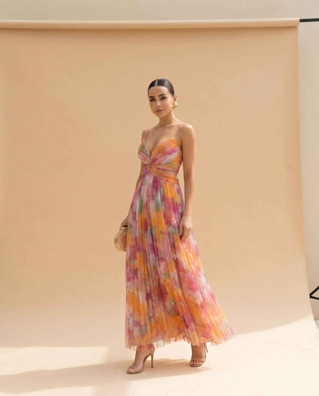 Giselle floral maxi dress styled with heels on a neutral backdrop
