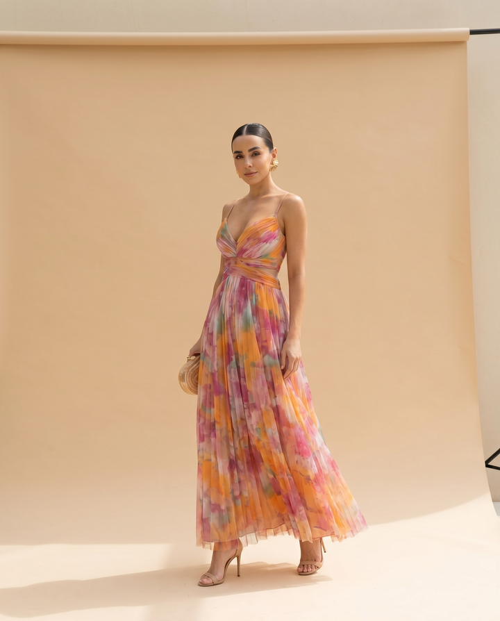 Giselle floral maxi dress styled with heels on a neutral backdrop