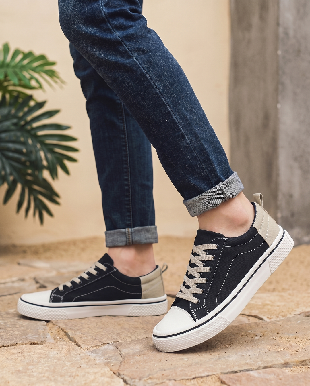 Milan trainers in black, worn walking — editorial lifestyle