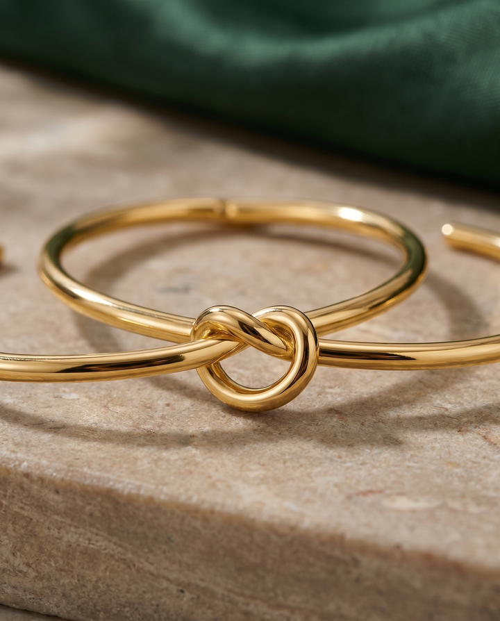 Gold knot cuff bracelet styled product close-up