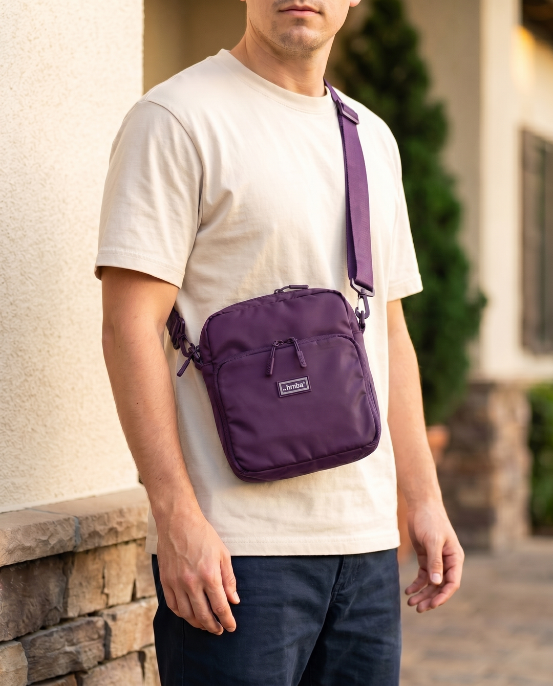 Foldable crossbody sling bag in Purple, worn
