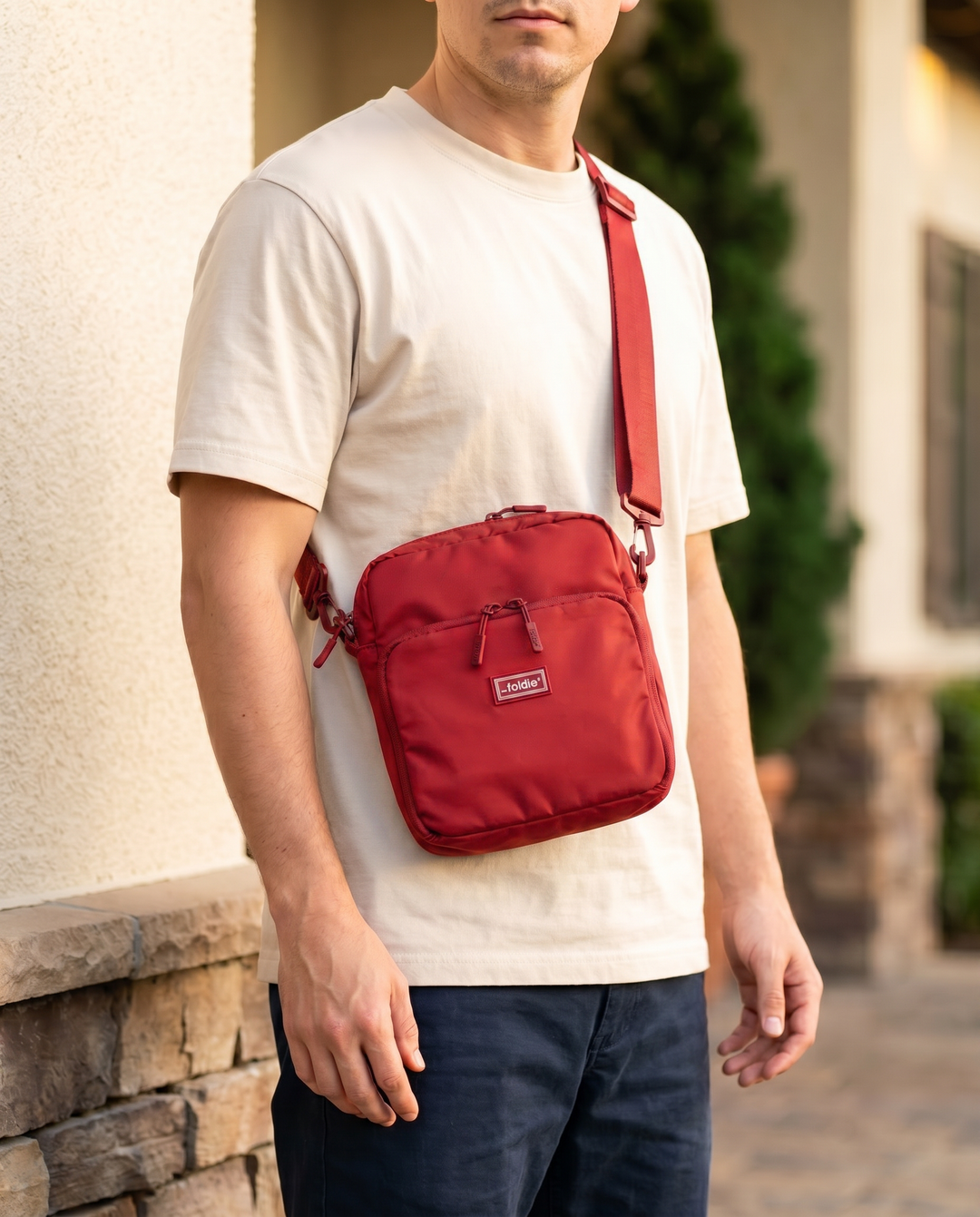 Foldable crossbody sling bag in Red, worn
