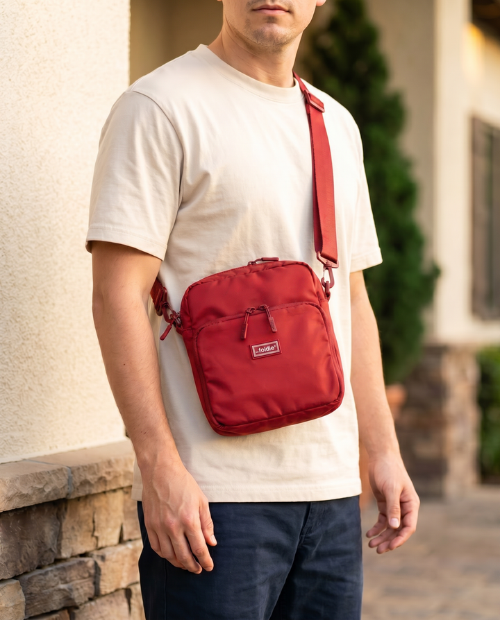 Foldable crossbody sling bag in Red, worn