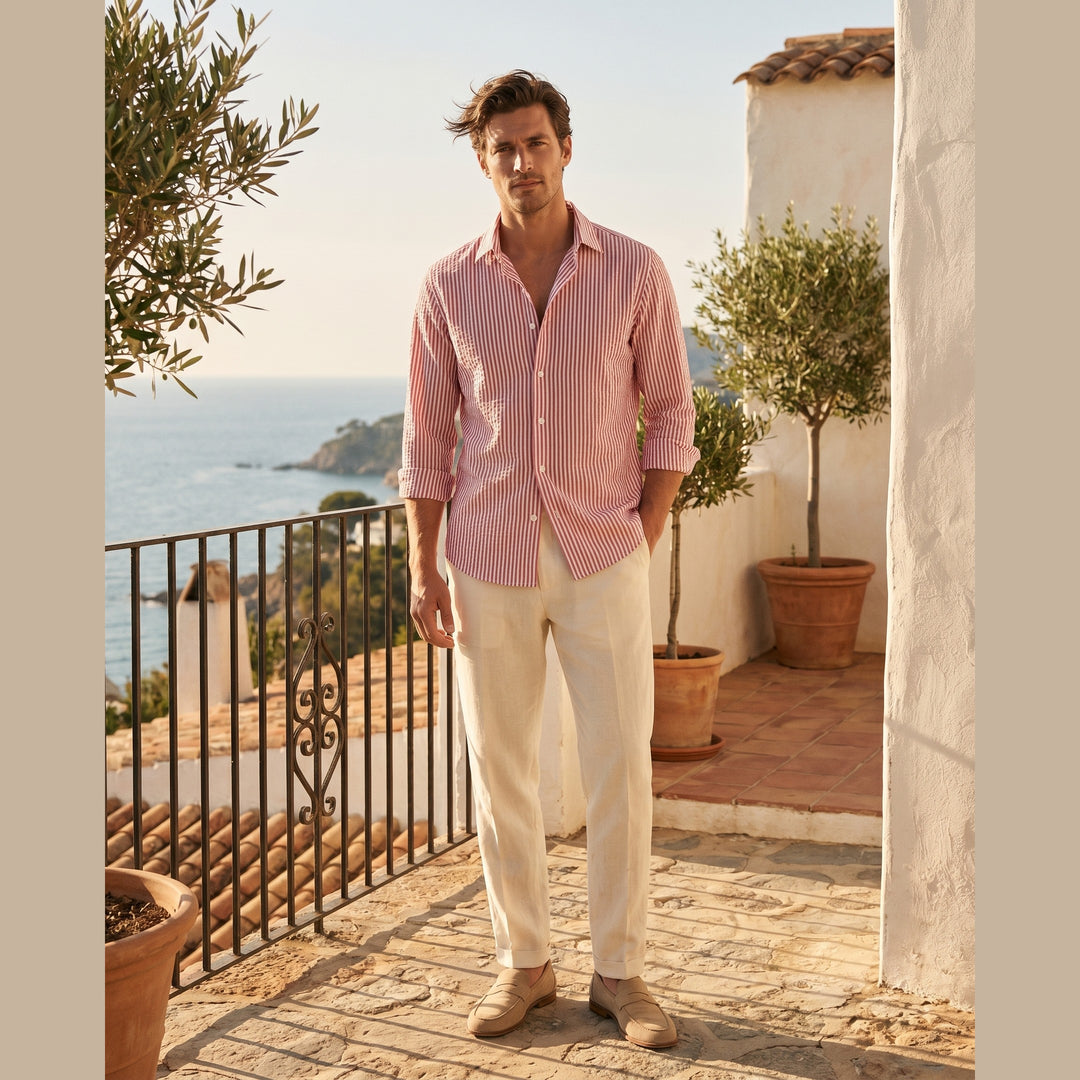 Man wearing the Marseille seersucker shirt on a sunlit terrace